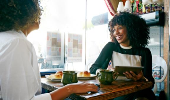Image of women enjoying coffee at a local cafe