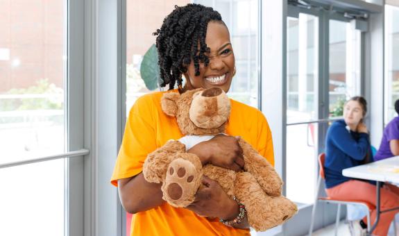 Image of Spire employee holding a teddy bear at Children's Hospital of Alabama